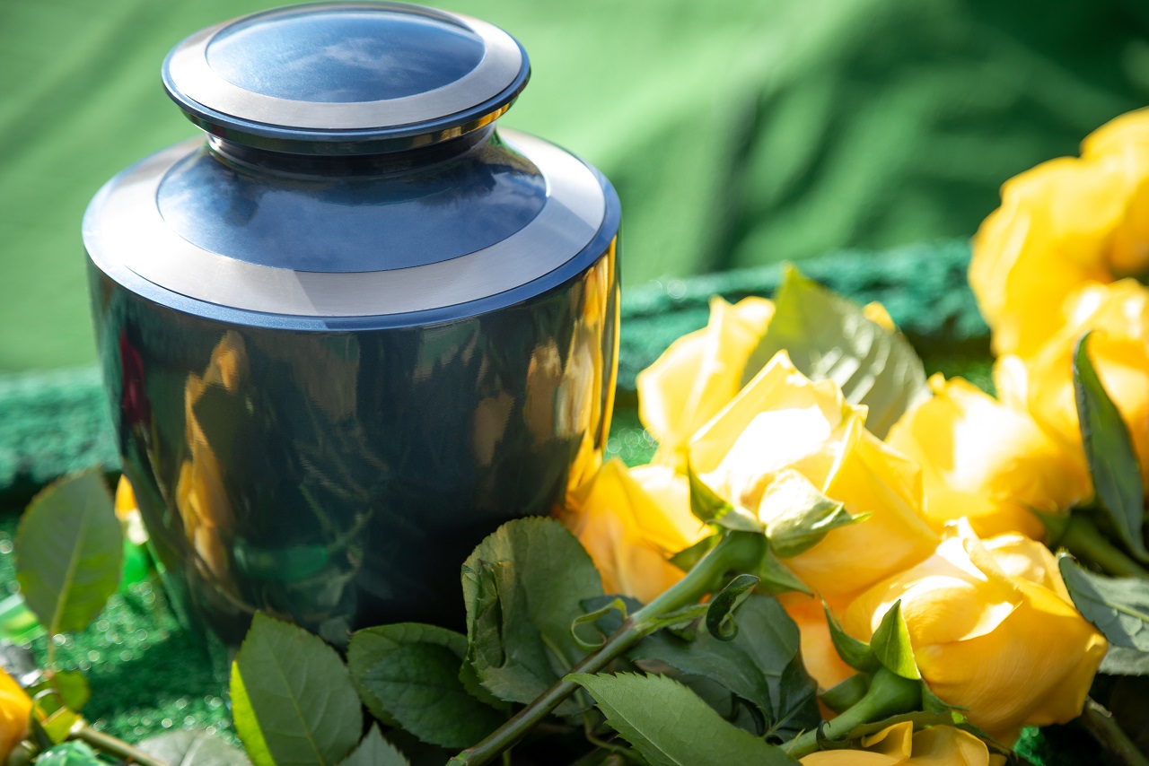 funeral cremation urn with yellow roses