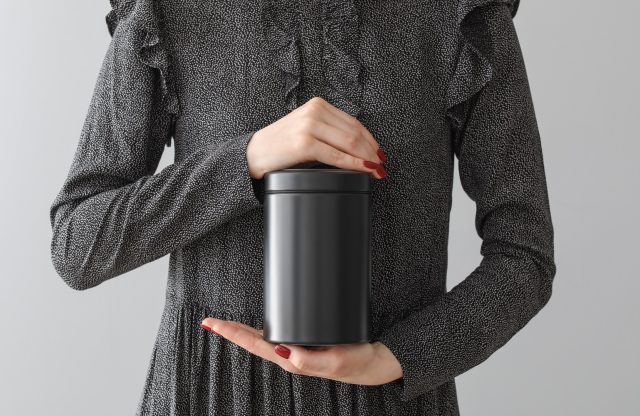Woman with mortuary urn